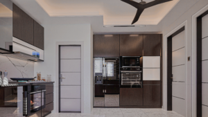 A long shot view of a beautiful modern kitchen with light grey tiled floor and wooded shaded cabinets.
