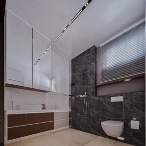 An executive bathroom with a hanging WC and black shaded wall tiles