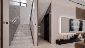 The stairway of a living room leading to the first floor. The TV mounted on the left wall has a white background.