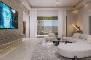 THE SIDE VIEW OF THE LIVING AREA OF a 3 bedroom house for sale in Accra Ghana - SHOWING THE TVE ON THE WALL ON THE LEFT AND THE CRESCENT SHAPED SOFA ON THE RIGHT SIDE - Regimanuel Satellite City