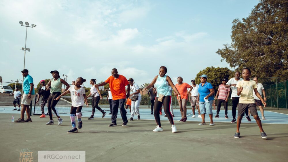 Residents at Regimanuel Gray Estates having a morning fitness routine on the tennis court at the estate's Club House - Ghana's Most Trusted Real Estate Developer