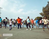 Residents at Regimanuel Gray Estates having a morning fitness routine on the tennis court at the estate's Club House - Ghana's Most Trusted Real Estate Developer
