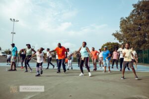 Residents at Regimanuel Gray Estates having a morning fitness routine on the tennis court at the estate's Club House - Ghana's Most Trusted Real Estate Developer
